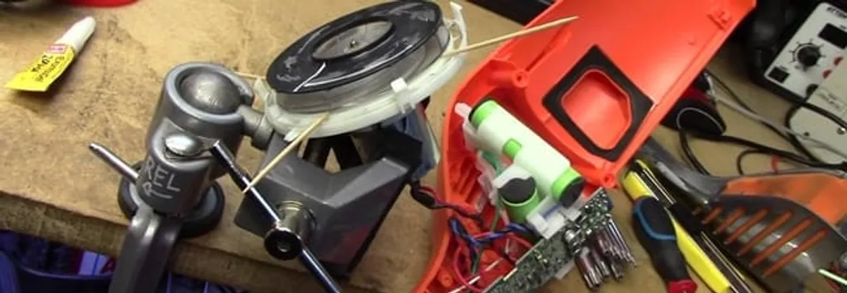Vacuum cleaner repair parts and tools on a workbench in Cape Coral, FL